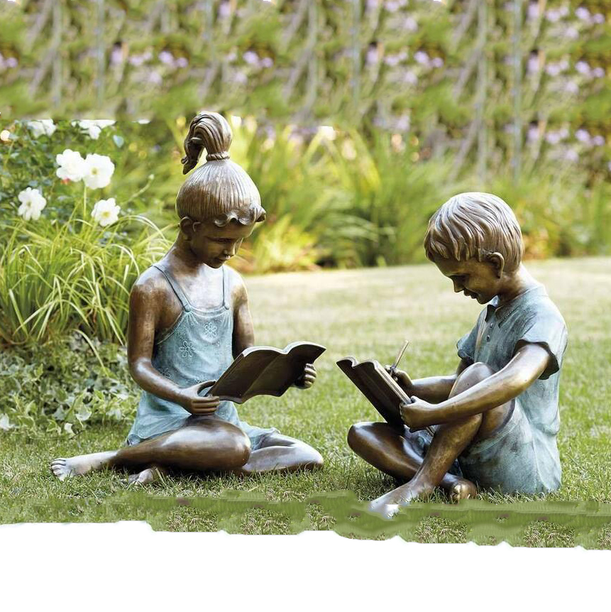 Boy and girl reading bronze garden statues